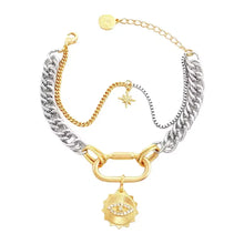 Gold and silver chain bracelet with star and evil eye pendants