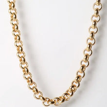 Gold chain necklace on a light gray background