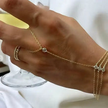 gold triple chain bracelet worn by woman