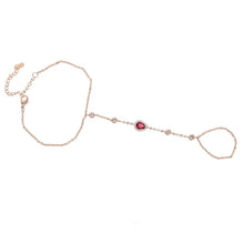 Delicate finger and wrist chain bracelet with a  ruby