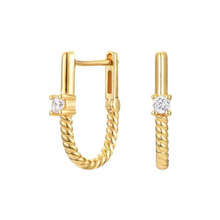 Gold hoop earrings with diamond accents on a white background